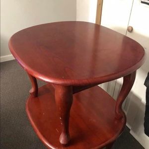 Two brown end tables and a hot dog maker